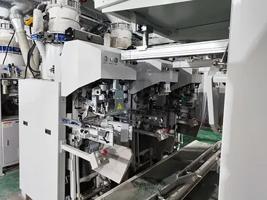 نظام شفط ووضع الأكياس الفارغة في فتحة التعبئة